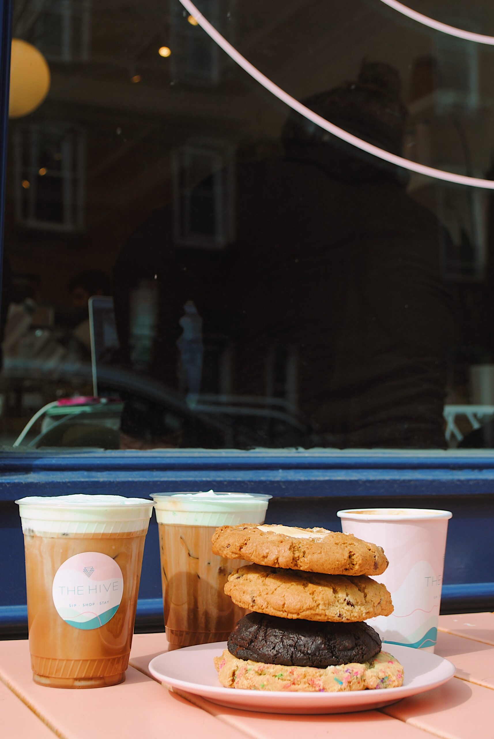 Cookies and iced coffee in front of The Hive.