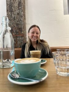 Alex in front of a Cortado on the table. 